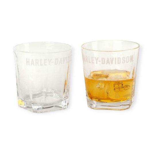 Two Harley-Davidson glasses, one filled with a drink on a white background